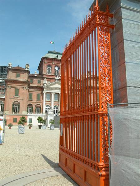 Orange wrought-iron gate in front of Racconigi Royal Castle