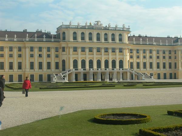 Visitors in front of the yellow facade of Upper Belvedere, Vienna