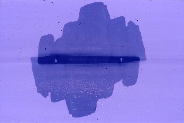 blue ink blot on purple paper, mirrored symmetrically, soft diffuse light
