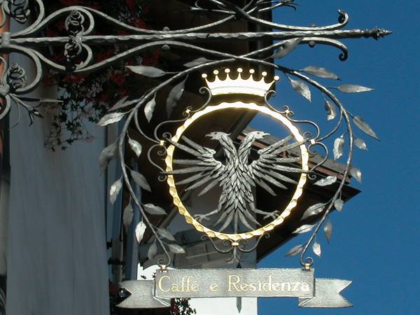 Wrought iron sign with double-headed eagle and crown for café and residence