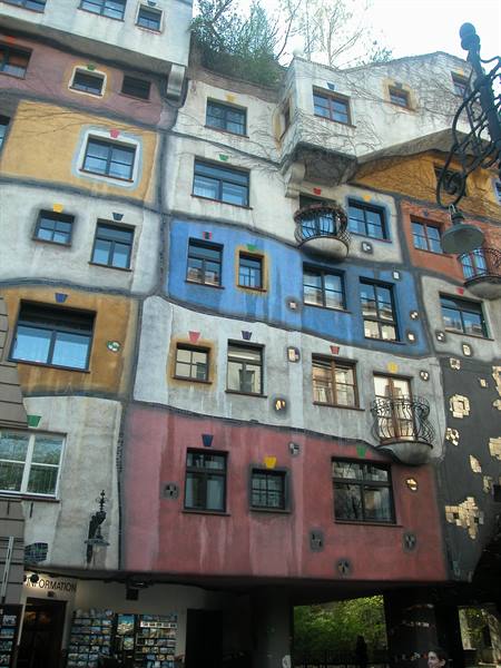 Wavy colorful facade with irregular windows, the Hundertwasserhaus in Vienna