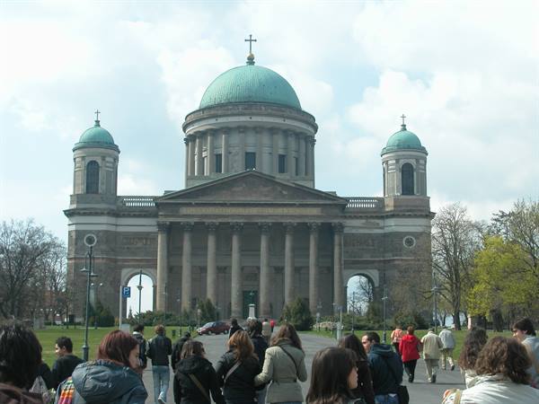 Tourists walk toward Esztergom Basilica with its green dome