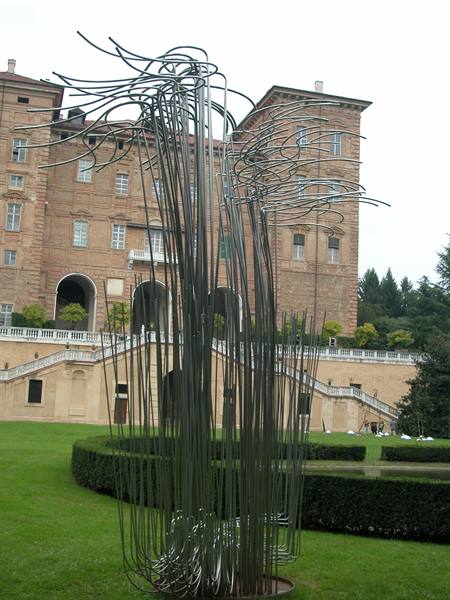 Curved steel pipe sculpture in front of Moncalieri Castle, on the lawn