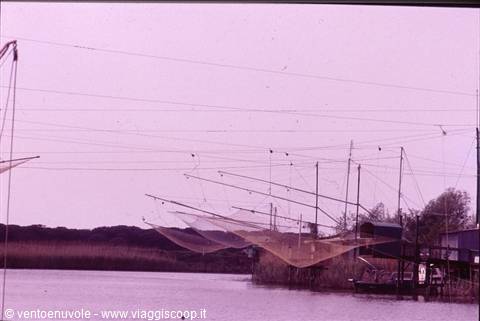 Fishing nets stretched on wooden poles in the Comacchio lagoons