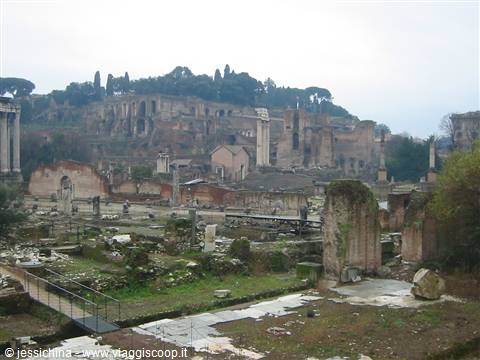 Ancient columns and ruined walls of the Roman Forum under grey sky