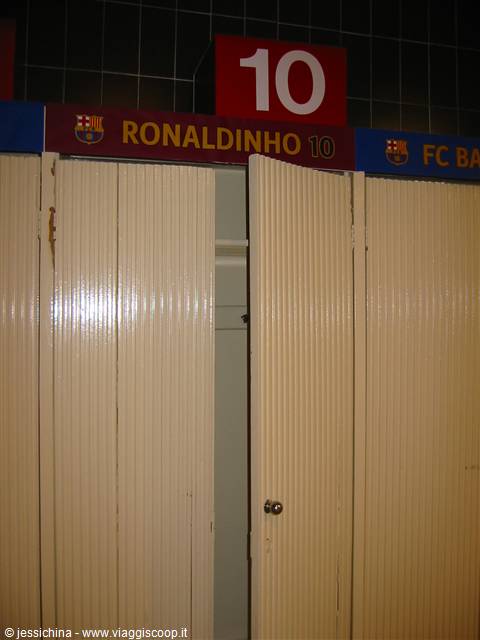 Open beige locker in Barça dressing room, Ronaldinho's red sign above