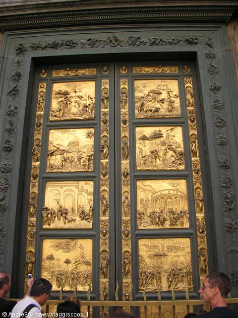 Tourists photograph the gilded bronze doors of Florence Baptistery
