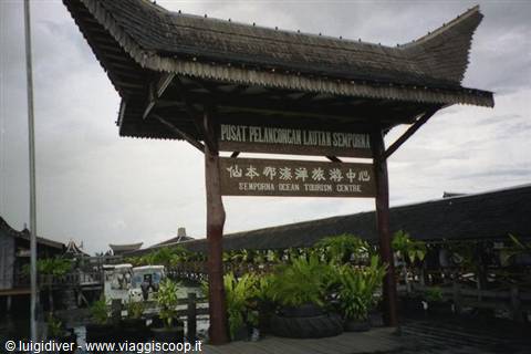 Wooden gateway with pagoda roof at Semporna Ocean Tourism Centre entrance