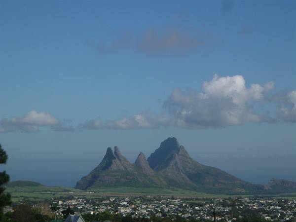 The Trois Mamelles over Curepipe, green rocky peaks above the town