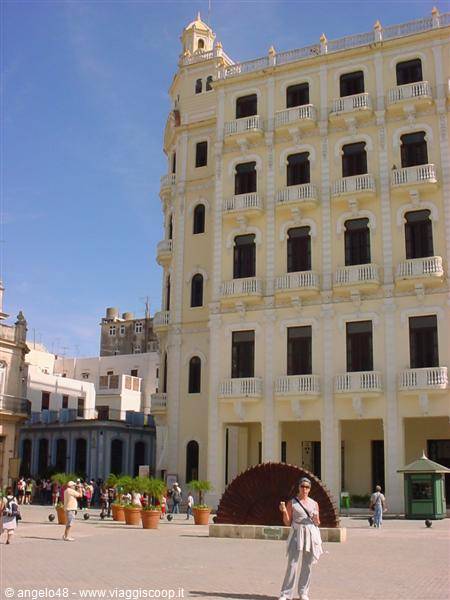 Tourist in front of the fishbone sculpture, Plaza Vieja, Havana