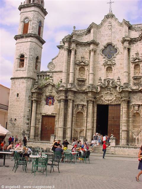 Havana Cathedral, baroque stone facade with outdoor café tables on the square