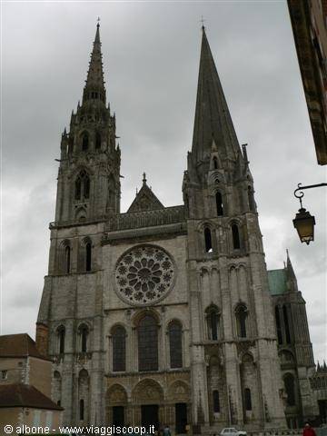 Chartres Cathedral: Gothic stone facade with rose window and two asymmetric spires