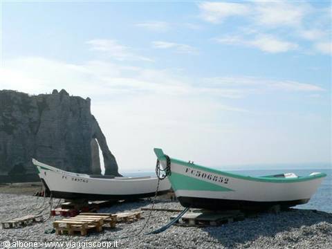 Fishing boats beached on the shingle shore at Étretat