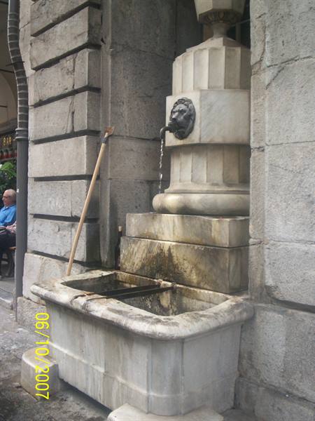 Little fountain along the city streets