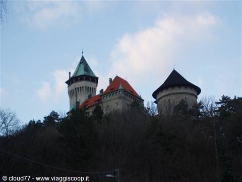 Bojnice Castle towers rising above bare winter trees