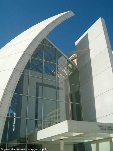 White concrete sail and glass facade of the Jubilee Church in Rome