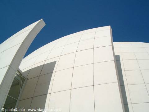 White concrete Calatrava curves, City of Arts and Sciences, Valencia, against blue sky