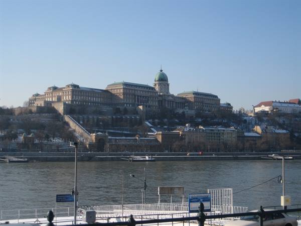 Buda Castle above the frozen Danube river in winter light