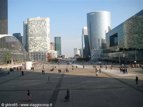 Crowded plaza among glass skyscrapers at La Défense, Paris