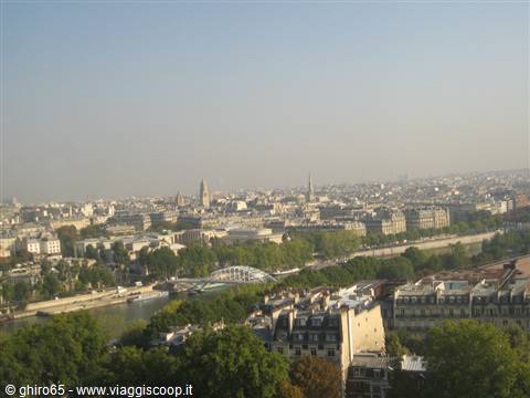 Paris: the Seine, grey rooftops and the Eiffel Tower in haze