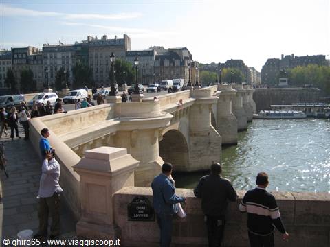 Tourists on Pont Neuf looking over the Seine, Paris