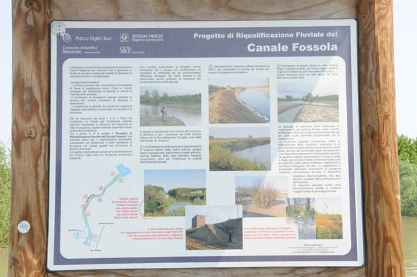 Wooden information board for the Fossola Canal river restoration project