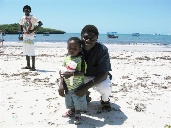 Rashid and his beautiful baby on the Blue Bay beach