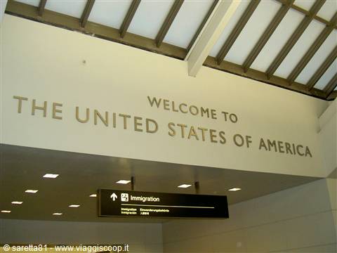 Welcome to the United States sign above the Immigration sign at the airport