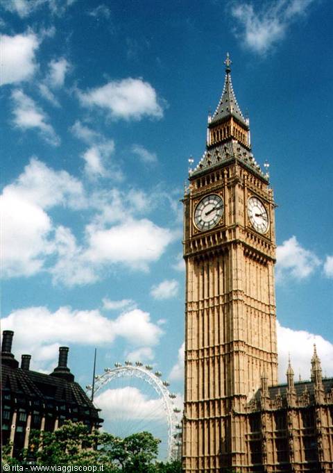 Big Ben clock tower in London, with the London Eye behind