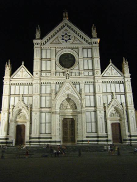 White and green marble facade of Santa Croce Basilica, Florence, at night