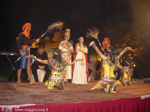 Night folklore show: dancers in traditional costumes perform on a lit stage