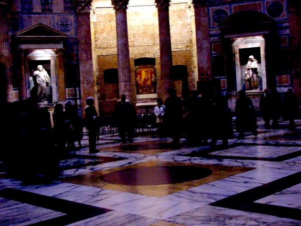 Multicolored marble floor and statues in niches inside the Pantheon, Rome