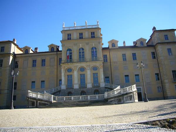 Palazzina di caccia di Stupinigi, yellow facade with white staircase and Italian flag