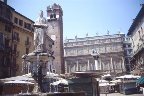 Madonna Verona fountain in Piazza delle Erbe with statues and market stalls