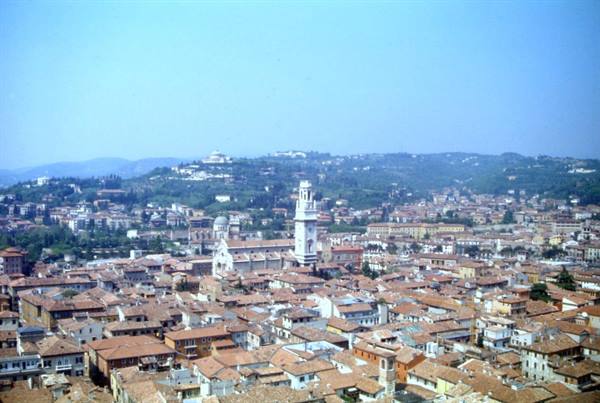 Verona: terracotta rooftops, the Duomo bell tower and green hills