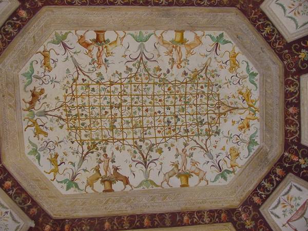 Octagonal frescoed ceiling with vines, animals and cherubs in Roman style