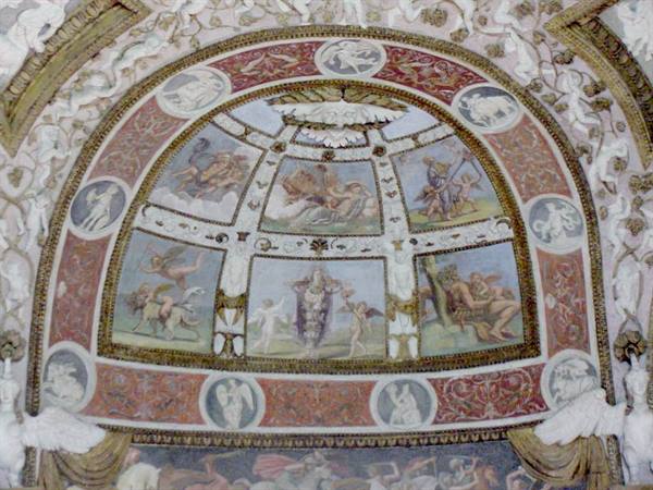 Frescoed vault with mythological scenes and white stuccoes, soft light