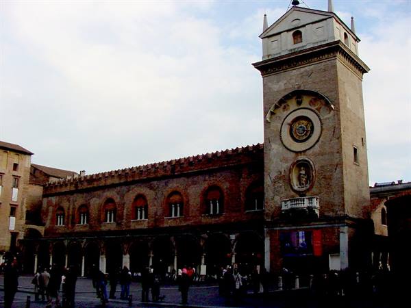 Tourists beneath the brick Clock Tower, Piazza dei Signori, Padua
