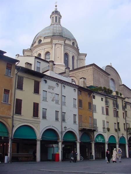 Green-awning arcades and the Duomo Nuovo dome in Brescia