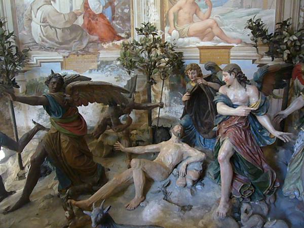 Polychrome sculptural group with angels around a lifeless body