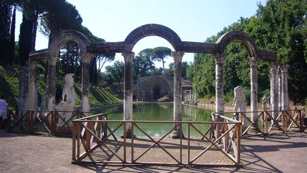 Hadrian's Villa: curved columns and statues reflect in the Canopus pond