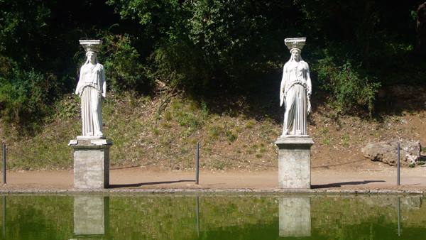 Two marble caryatid statues reflected in the pond at Hadrian's Villa