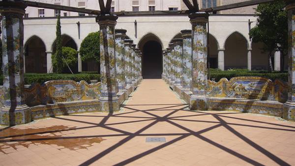 Majolica-tiled cloister columns and arches at Santa Chiara, Naples