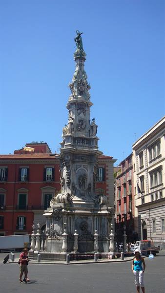 Marble Spire of the Immaculate, Piazza del Gesù Nuovo, Naples, under clear blue sky