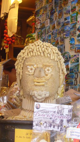 Face sculpture made of Gragnano pasta in a food shop