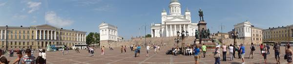 Senate Square in Helsinki, tourists in front of the white cathedral and statue