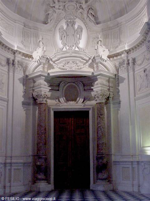 Dark marble portal with spiral columns and white Baroque stuccoes, Venice