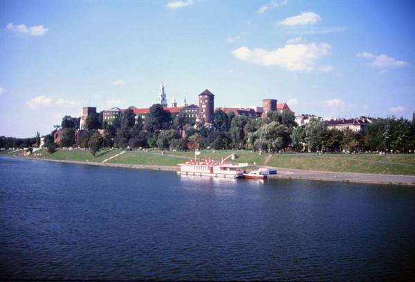 Tourist boat moored on the Vistula River in front of Wawel Castle