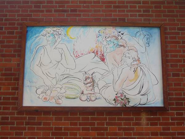 Framed mythological painting on red brick wall, figures with fruit and goat