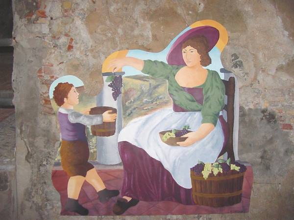 Fresco on old wall: woman with grapes and child